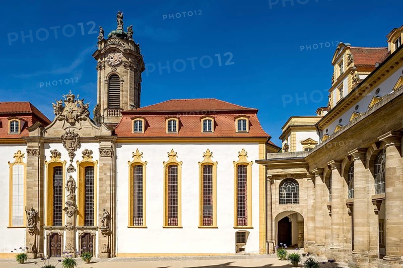 Castle courtyard with baroque castle church and colonnades