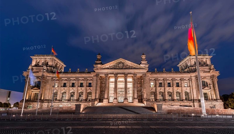 Reichstag with waving German flag