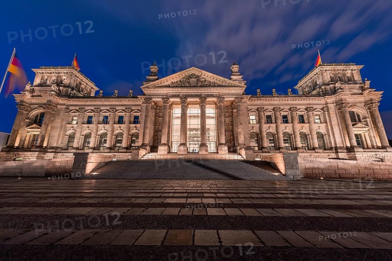 Reichstag with waving German flag
