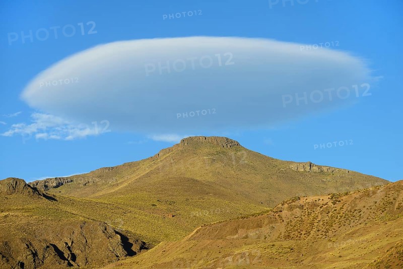 Lenticular cloud over bare mountain