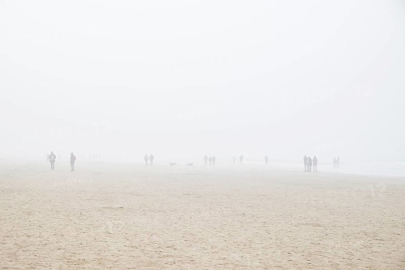 Beach with people in fog