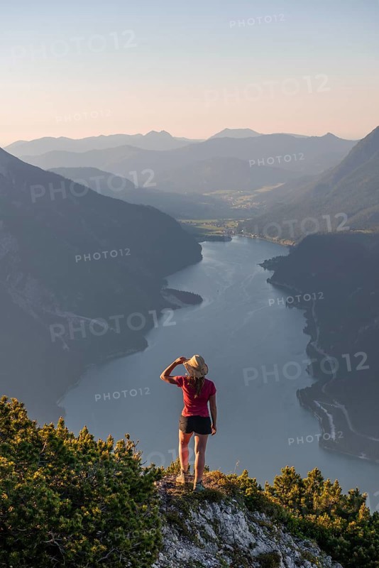 Young woman looking over mountain landscape