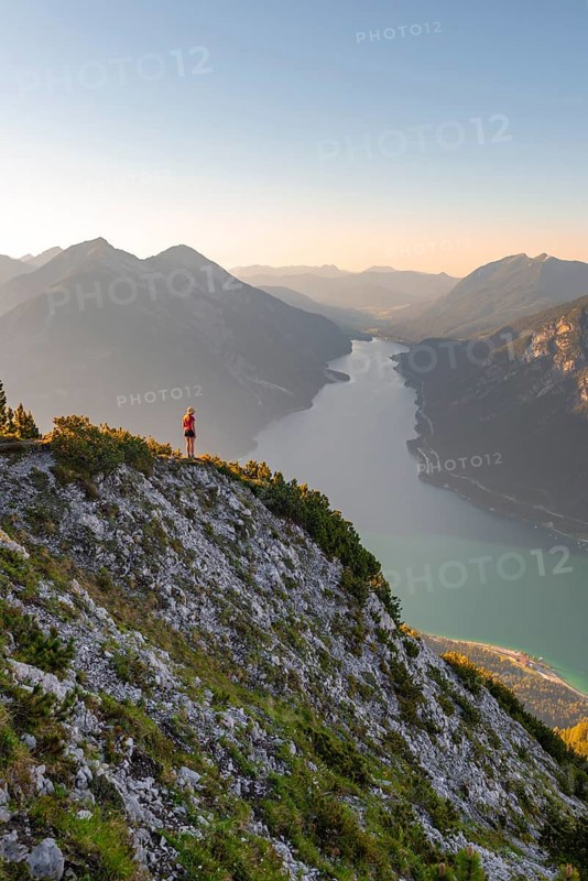 Young woman looking over mountain landscape