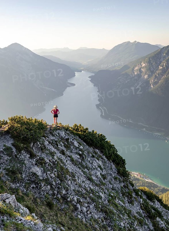Young woman looking over mountain landscape