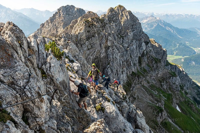 Mountaineer on a secured fixed rope route
