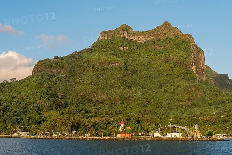 Village of Vaitape on the volcanic cone Mont Otemanu