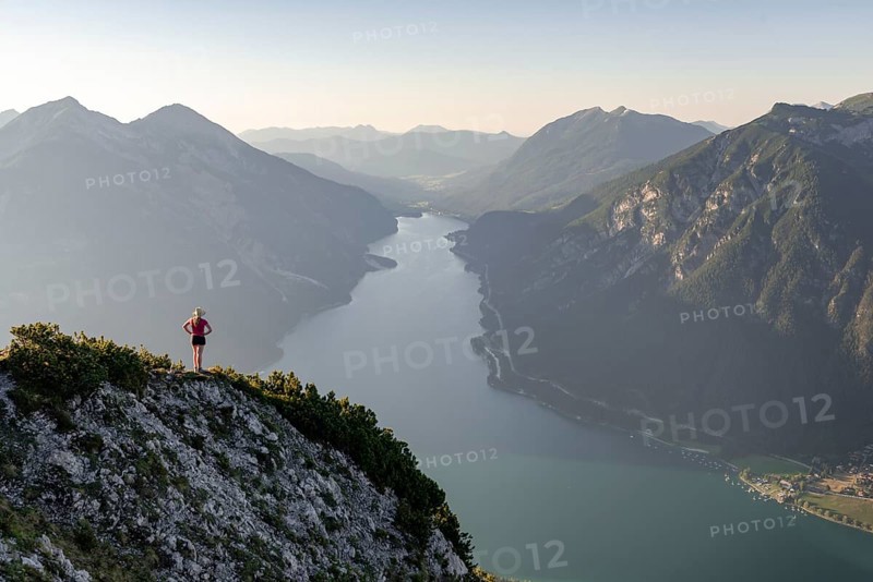 Young woman looking over mountain landscape