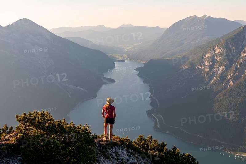 Young woman looking over mountain landscape