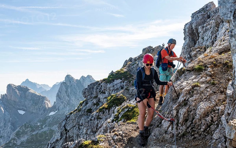 Mountaineer on a secured fixed rope route