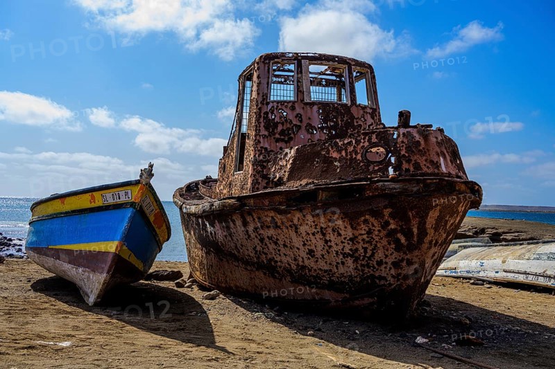Old rusty boat on the beach at Pedra Lume