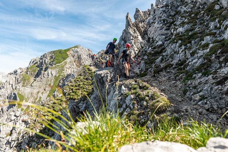 Mountaineer on a secured fixed rope route