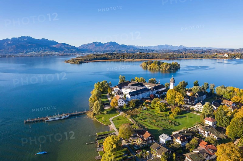 Steam jetty and Benedictine monastery Frauenwoerth on Fraueninsel