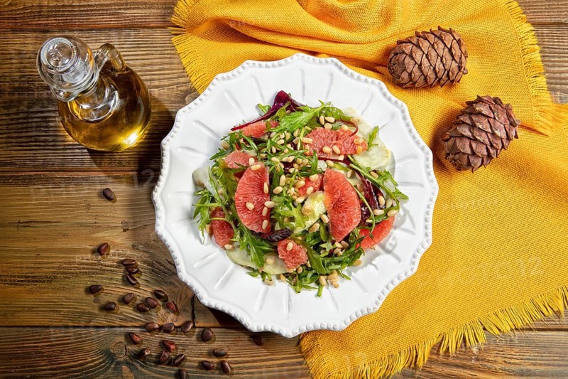 Served salad on a plate with grapefruit