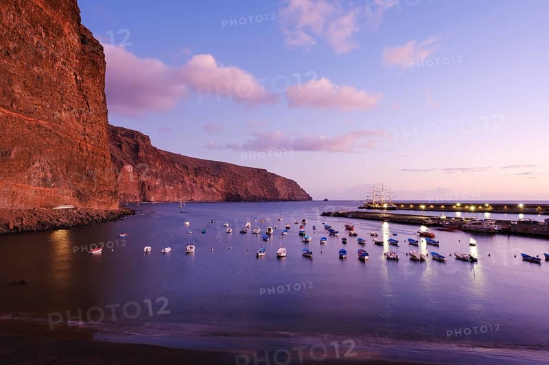 Fishing boats in the fishing port at dusk