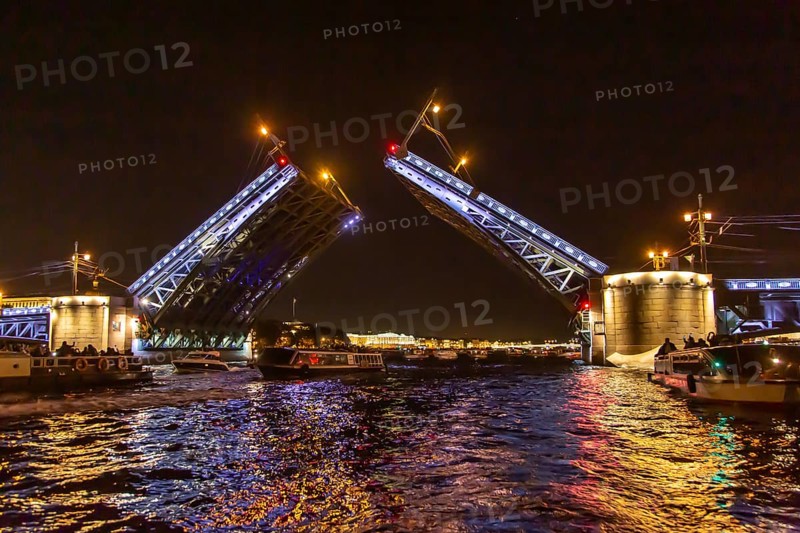 Opened Palace bridge over the river Neva at night