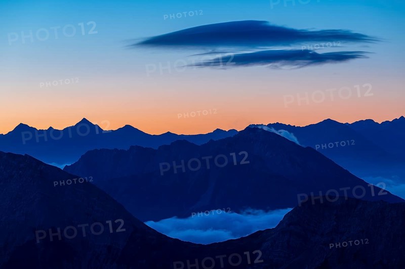 Sunrise over Lechtal Alps with fog in the valley