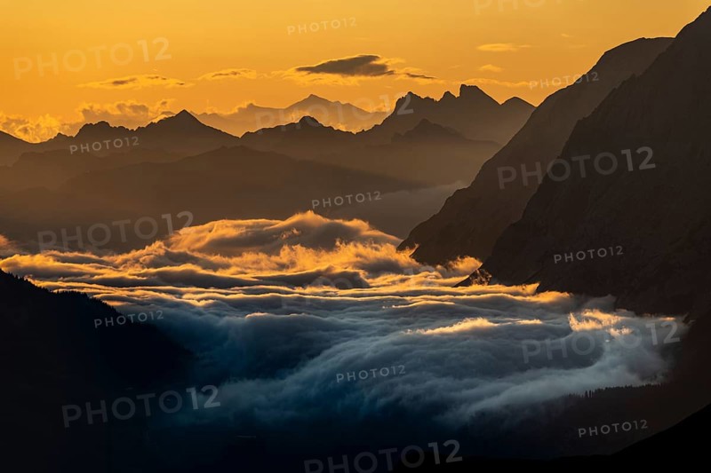 Sunrise over Lechtal Alps with fog in the valley