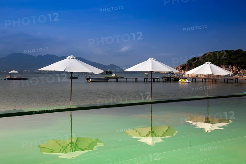 Swimming pool with parasols
