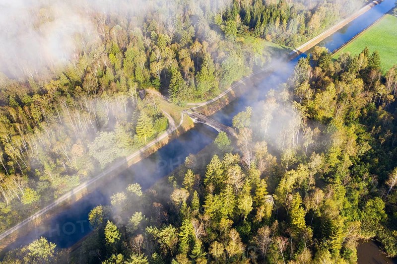Wafts of fog over the Isar-Loisach Canal near Geretsried