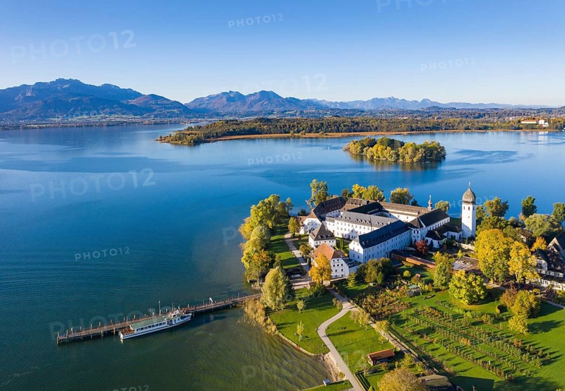 Steam jetty and Benedictine monastery Frauenwoerth on Fraueninsel