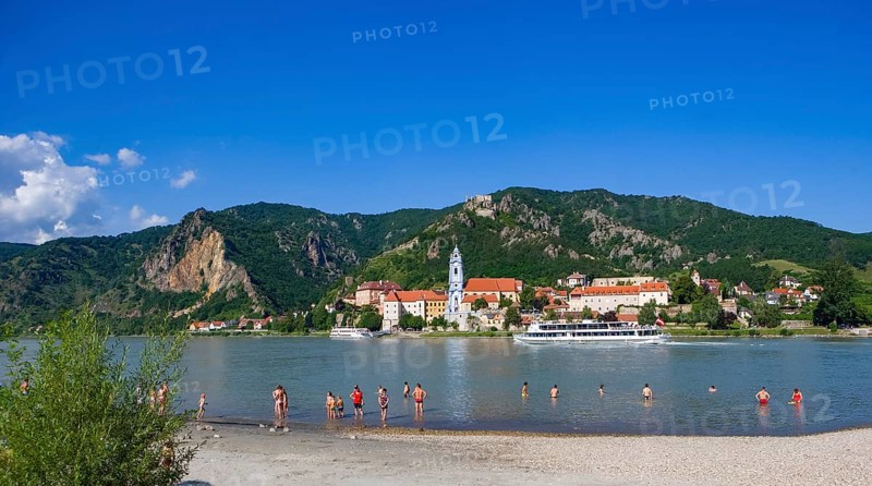 Bathing beach on the Danube with view of Duernstein Abbey