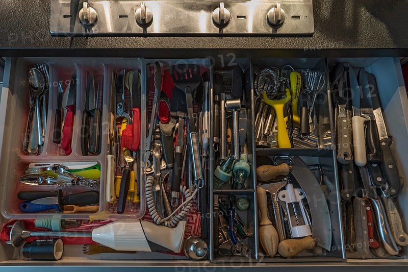 Drawer with many different kitchen utensils