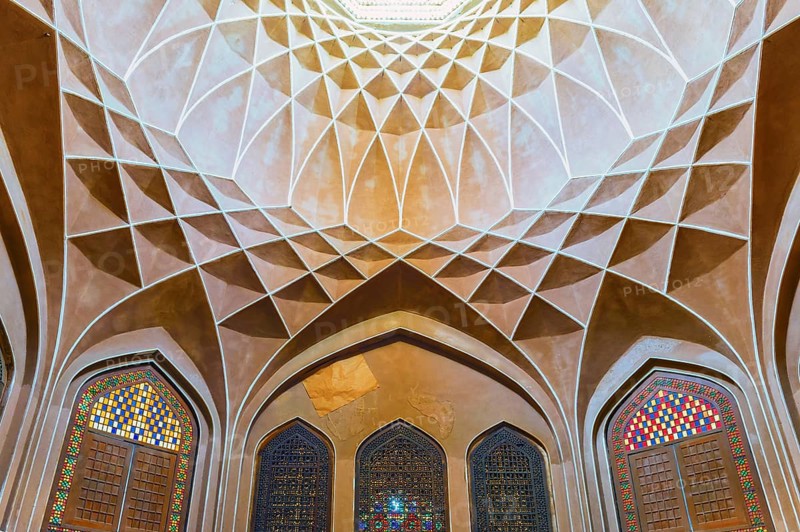 Pavilion under the wind catcher and colourful stained glass windows