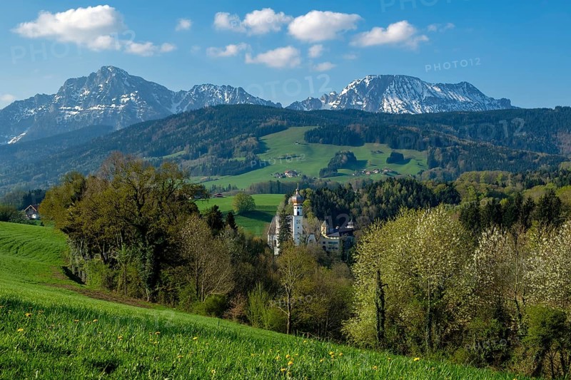 Former monastery Hoeglwoerth in front of the Berchtesgaden Alps