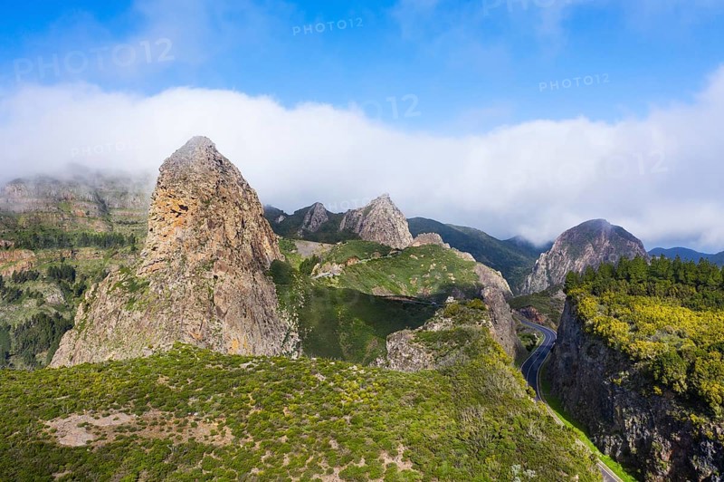 Volcanic rock towers Roque de Agando with Roque de Zarcita and Roque de Ojila and high road