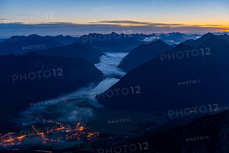 Sunrise over Lechtal Alps with fog in the valley
