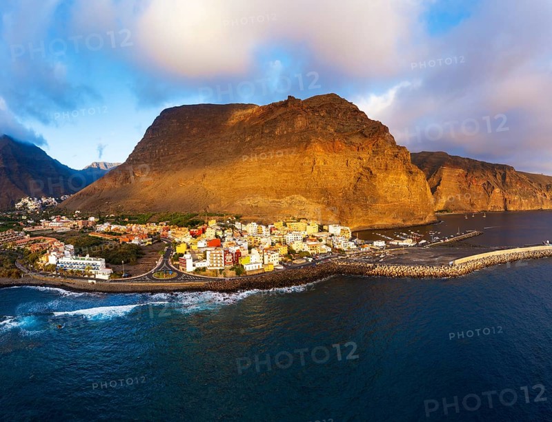 Vueltas with fishing harbour and mountain Tequergenche in the evening light