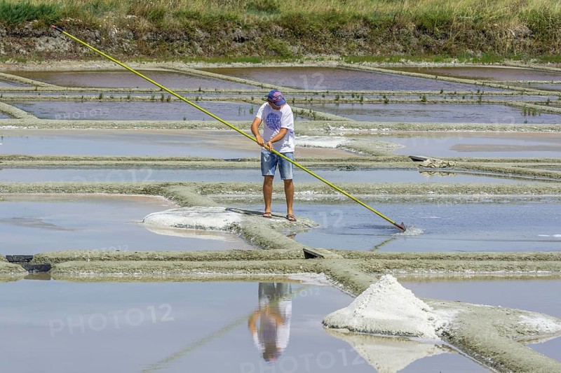 Man skimming salt