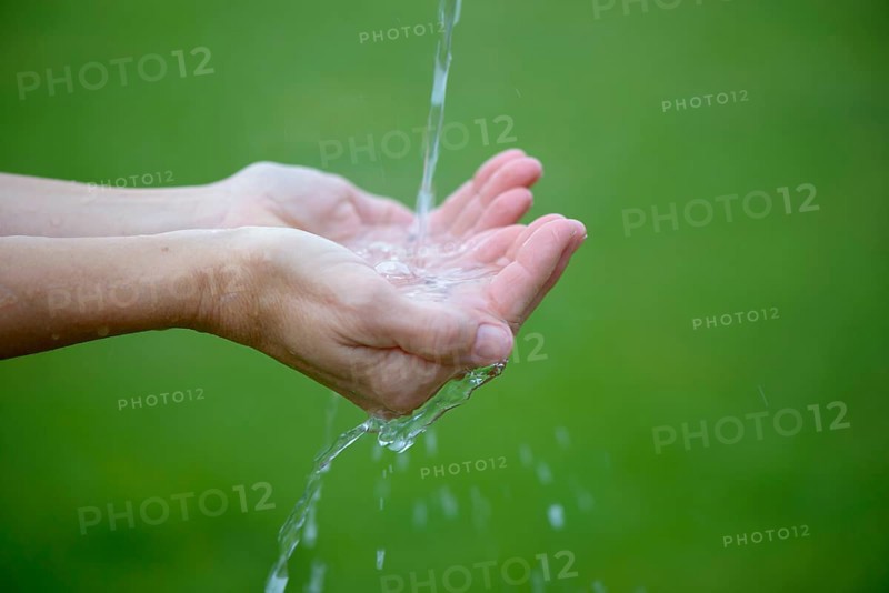 Water jet flows into hands