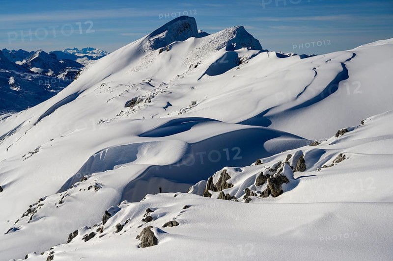 Summit of the Toreck with snow cornices and blue sky