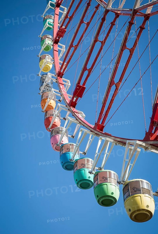 Colorful gondolas in front of a blue sky