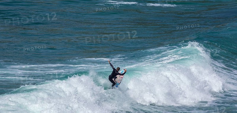 Surfers in the bay of Minou