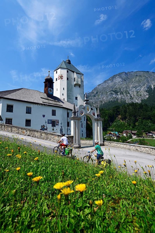 Cyclists in front of the pilgrimage church Mariastein