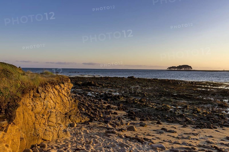 Coast in evening light with Pointe er Hourel in the background