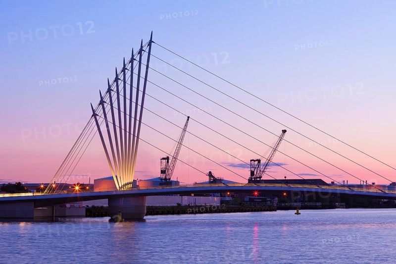 Media City footbridge and victorian cranes in afterglow