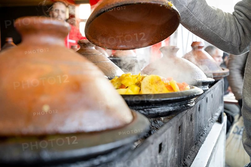 Delicious moroccan tajine prepared and served in clay pots