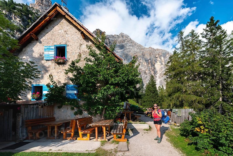 Hiker in front of a mountain hut