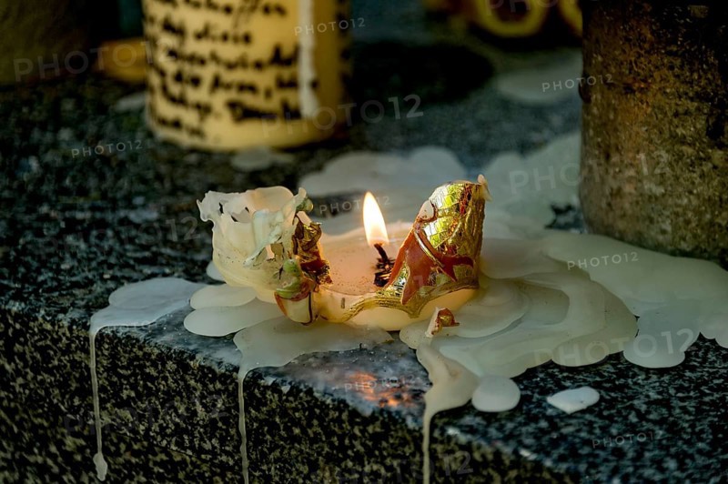 Burnt out sacrificial candle