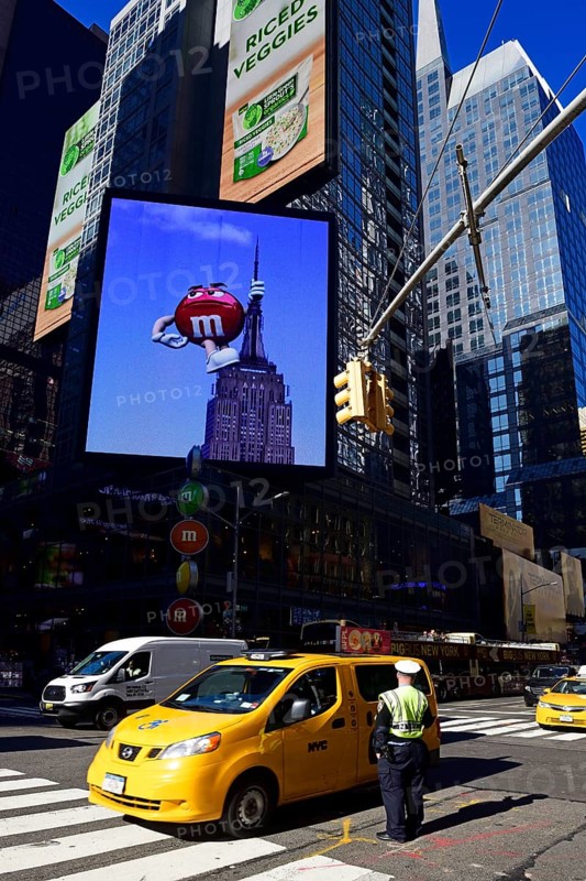 Traffic cop regulates traffic jam at Times Square