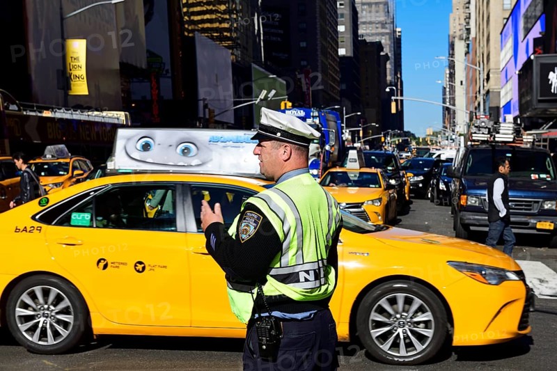 Traffic cop regulates traffic jam at Times Square