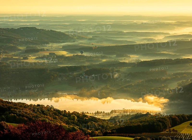 Stubenbergsee with autumn fog in the valley