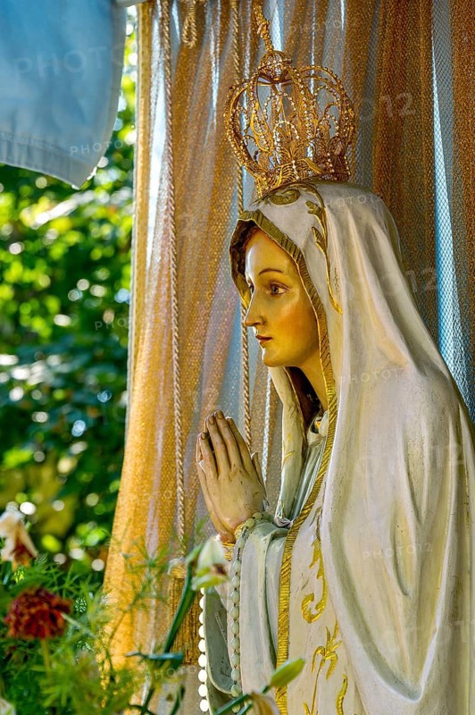 Statue of the Virgin Mary with golden crown of the Virgin Mary
