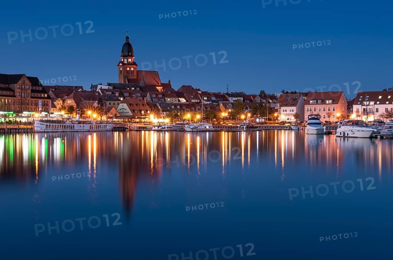 City harbour with church St. Marien at dusk
