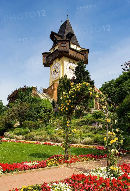Rose garden on the Schlossberg with clock tower