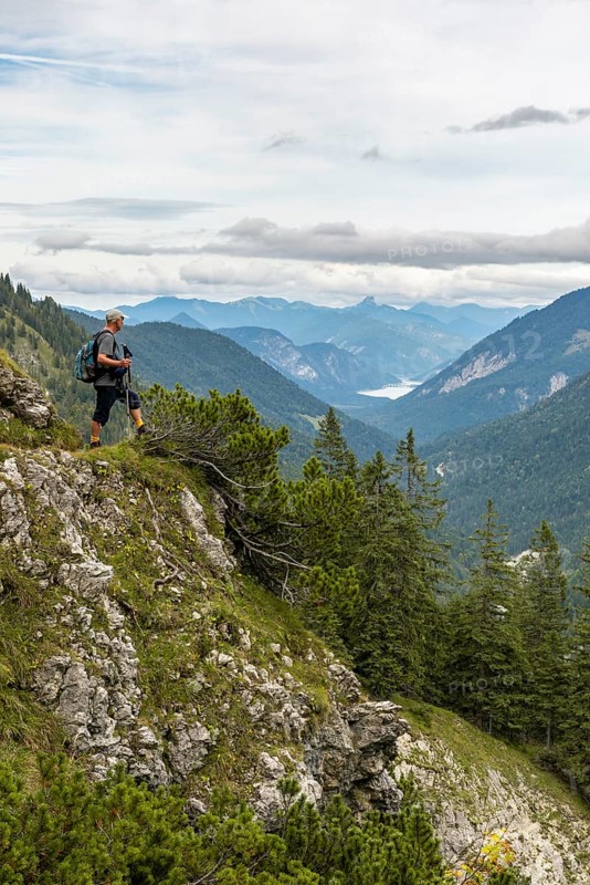 Hiker looks at the Sylvenstein Dam
