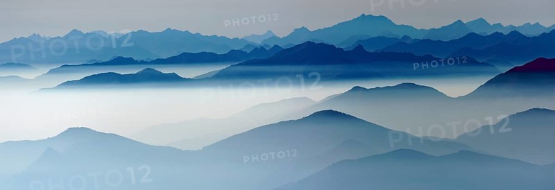 Blue graded mountain ranges in backlight